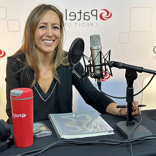 Patelco employee Michele Enriquez at the podcast desk